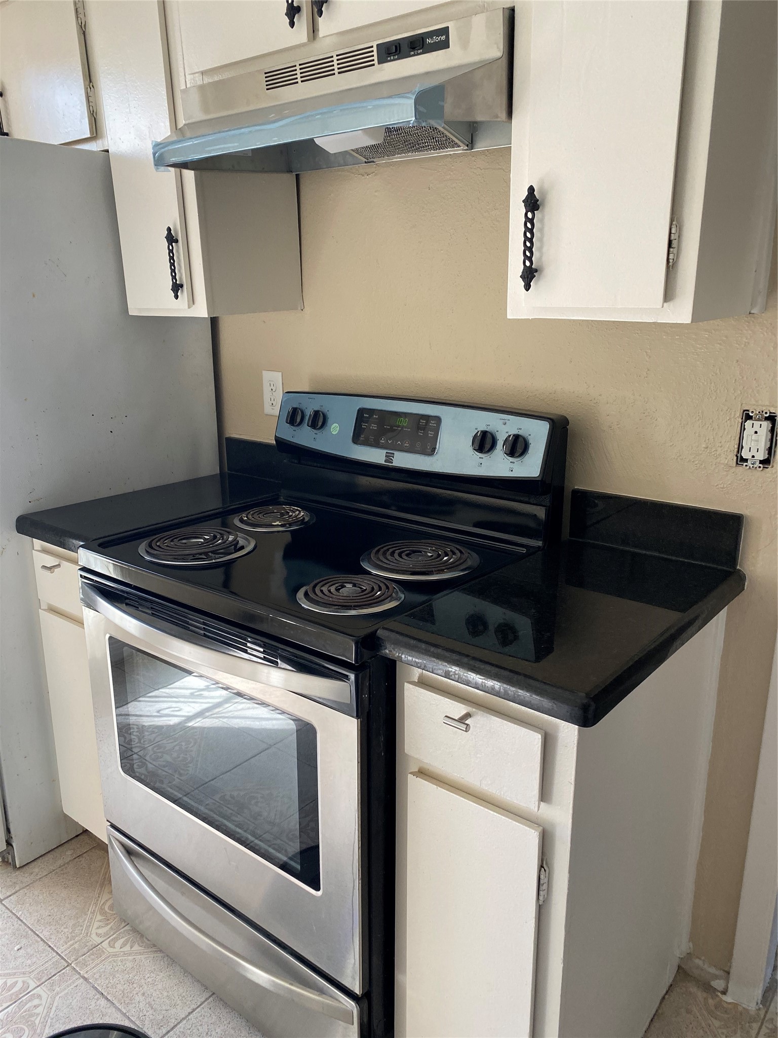 7952 Grove Ridge Drive Houston, TX 77061 - Photo 2 of 12 a stove top oven sitting inside of a kitchen