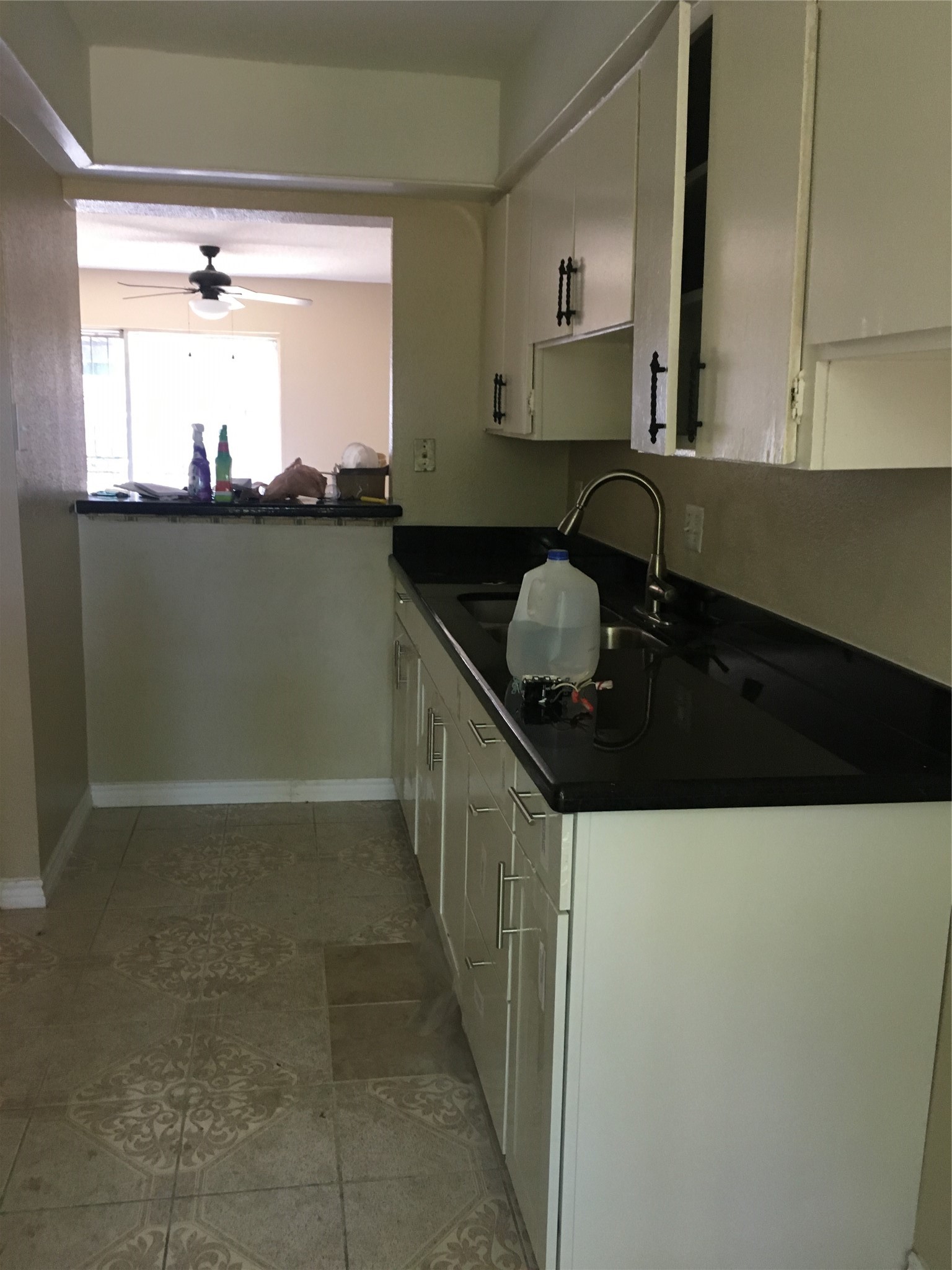 7952 Grove Ridge Drive Houston, TX 77061 - Photo 5 of 12 a kitchen with a sink and cabinets