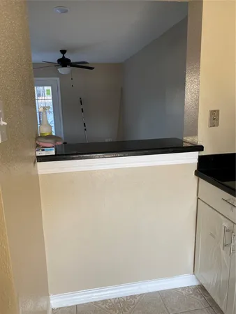 a view of a refrigerator in kitchen and wooden floor