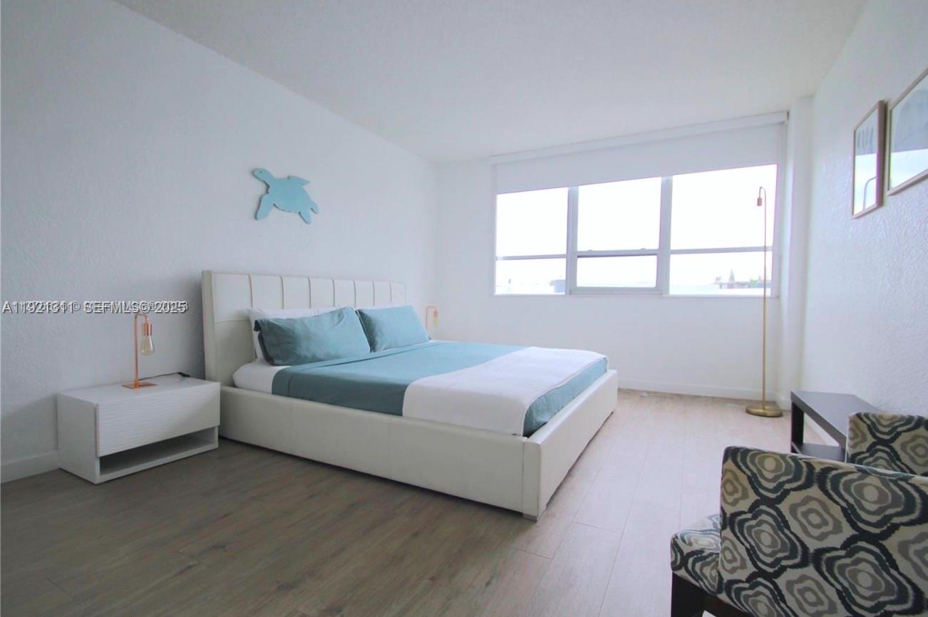 1500 Bay Road, Unit 374S Miami Beach, FL 33139 - Photo 12 of 33 a living room with furniture and a window