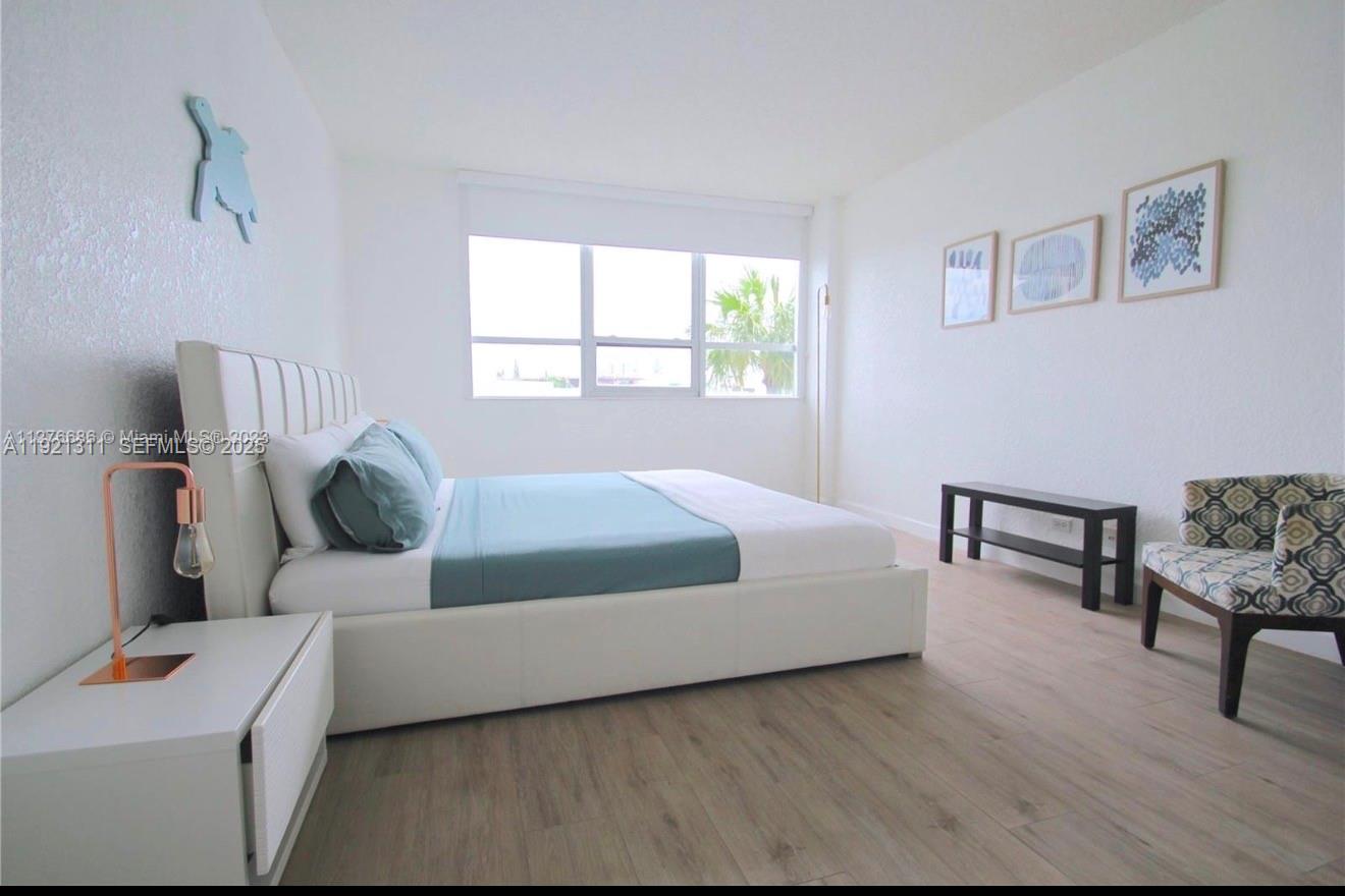 1500 Bay Road, Unit 374S Miami Beach, FL 33139 - Photo 15 of 33 a bedroom with a bed and a couch