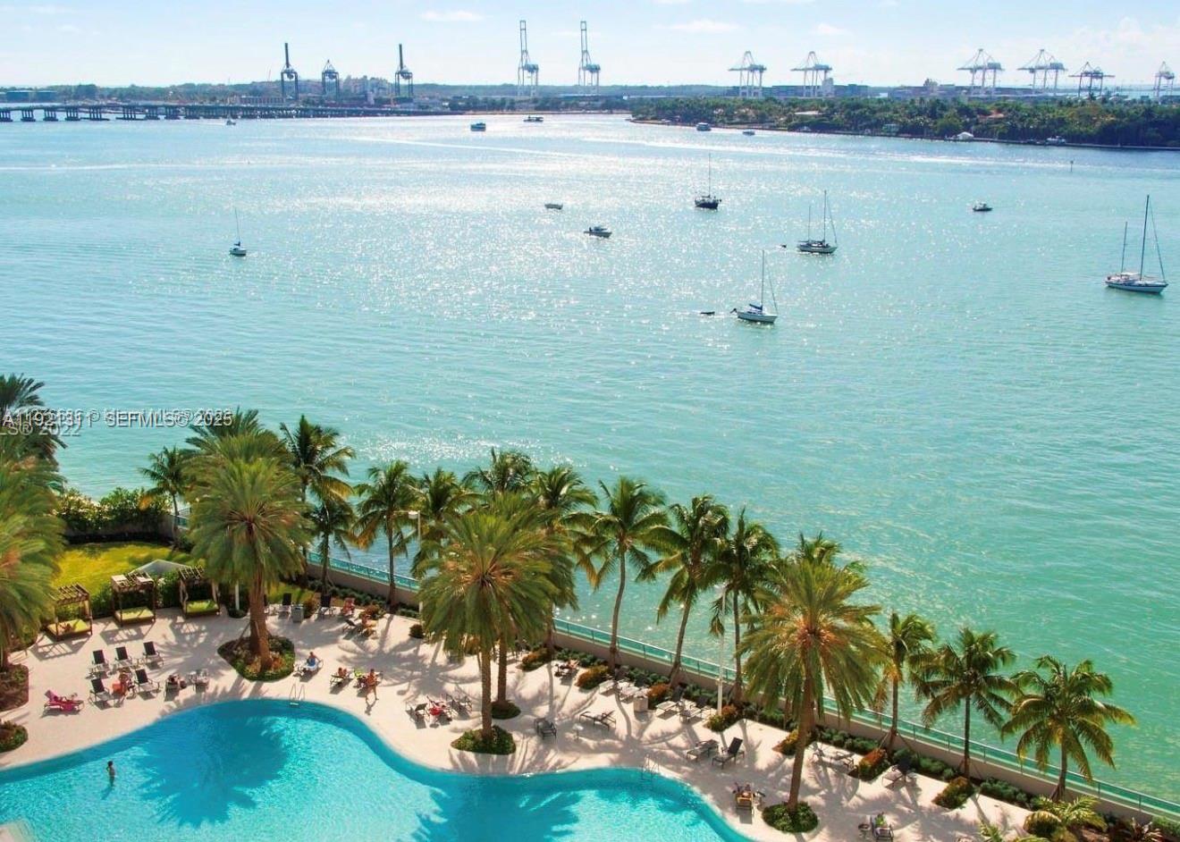 1500 Bay Road, Unit 374S Miami Beach, FL 33139 - Photo 27 of 33 a view of a lake with houses