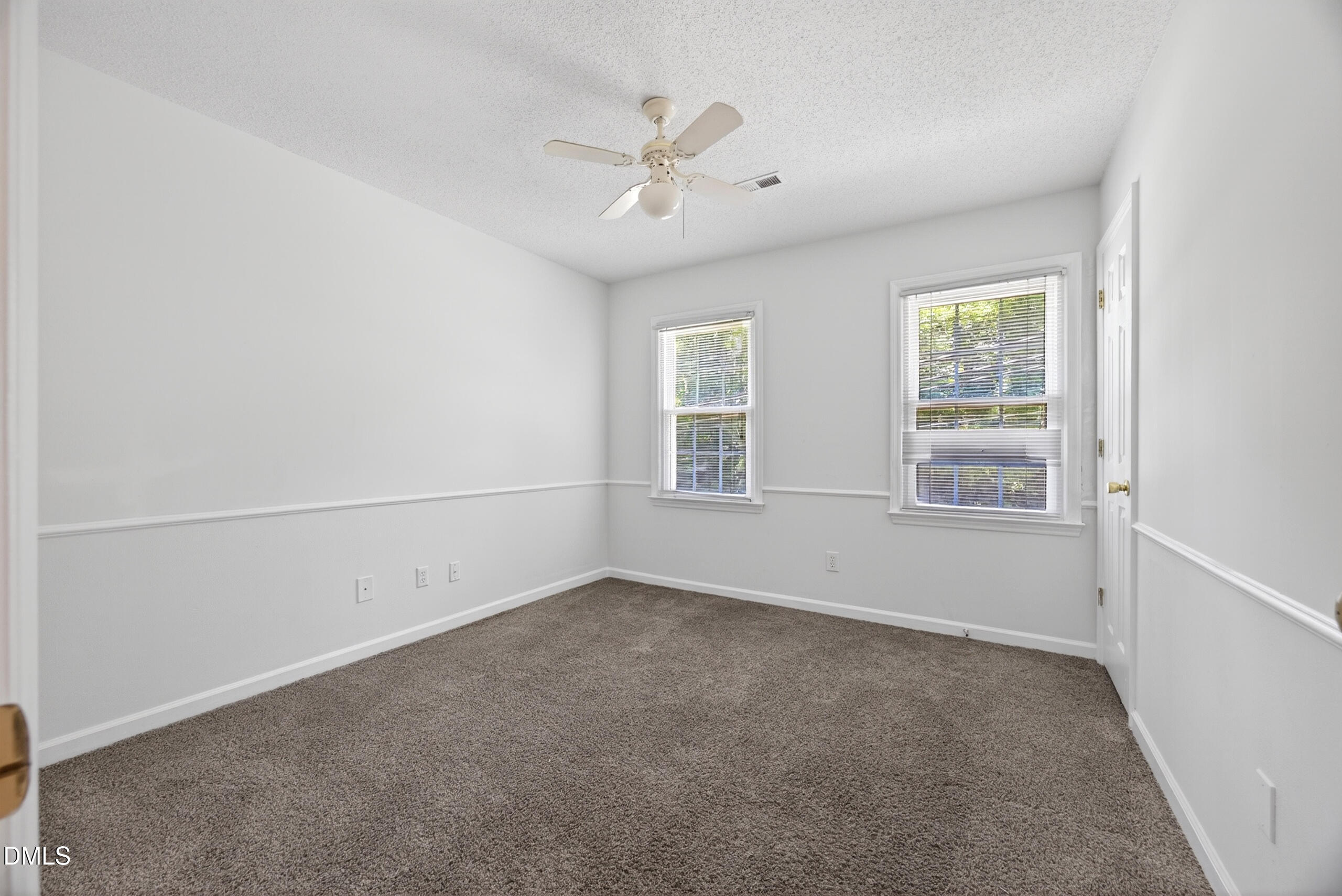 1901 Whites Mill Road High Point, NC 27265 - Photo 13 of 24 an empty room with windows and ceiling fan