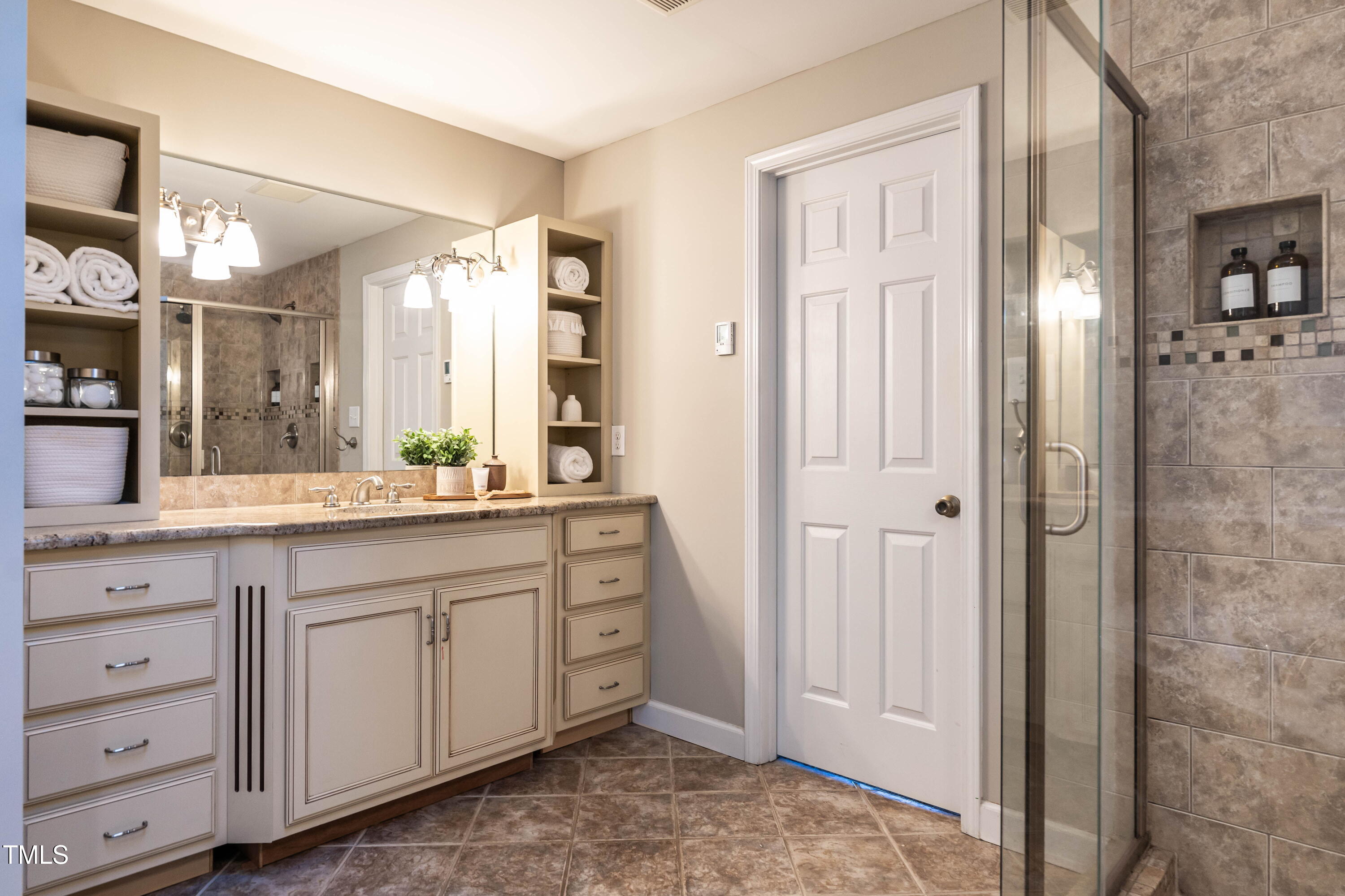 1001 Whetstone Court Raleigh, NC 27615 - Photo 18 of 31 a spacious bathroom with a granite countertop sink mirror and