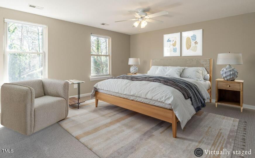 1001 Whetstone Court Raleigh, NC 27615 - Photo 20 of 31 a bedroom with a bed couch chandelier windows and a window