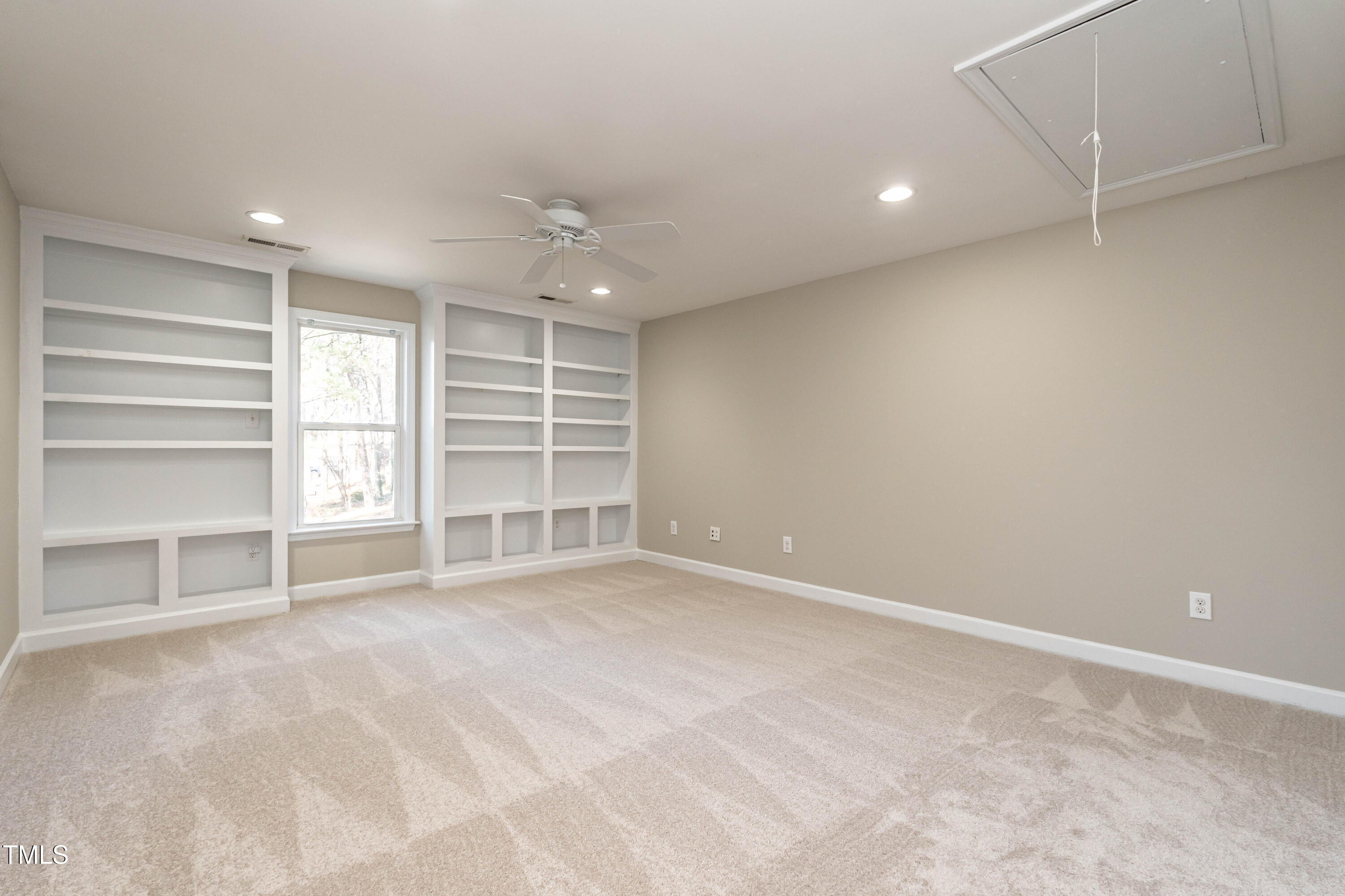 1001 Whetstone Court Raleigh, NC 27615 - Photo 25 of 31 a view of an empty room with a window and cabinet