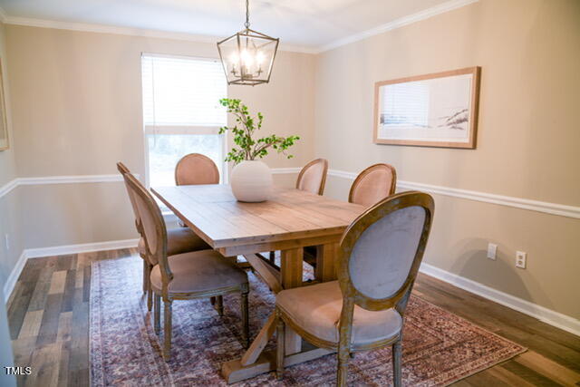 1001 Whetstone Court Raleigh, NC 27615 - Photo 3 of 31 a view of a dining room with furniture and chandelier