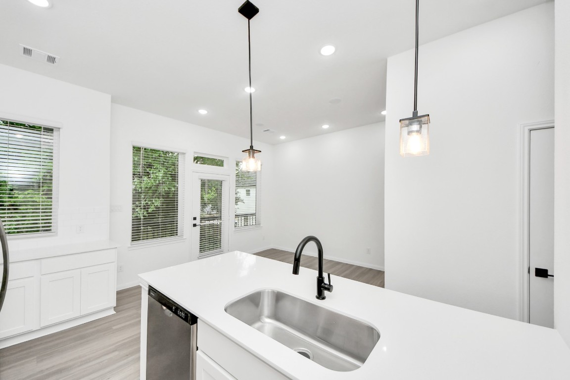 5103 Mallow Street, Unit B Houston, TX 77033 - Photo 11 of 30 a bathroom with a sink and a mirror