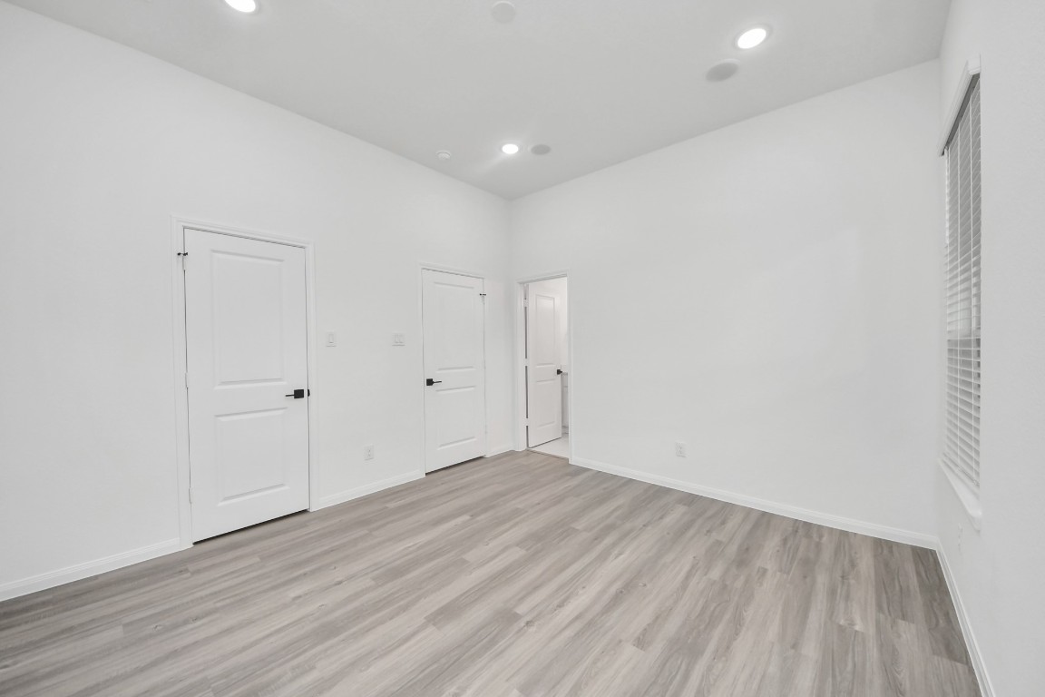 5103 Mallow Street, Unit B Houston, TX 77033 - Photo 25 of 30 a view of room with wooden floor