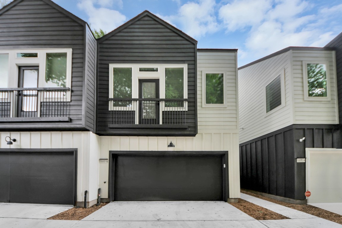 5103 Mallow Street, Unit B Houston, TX 77033 - Photo 26 of 30 a black and white building with black door