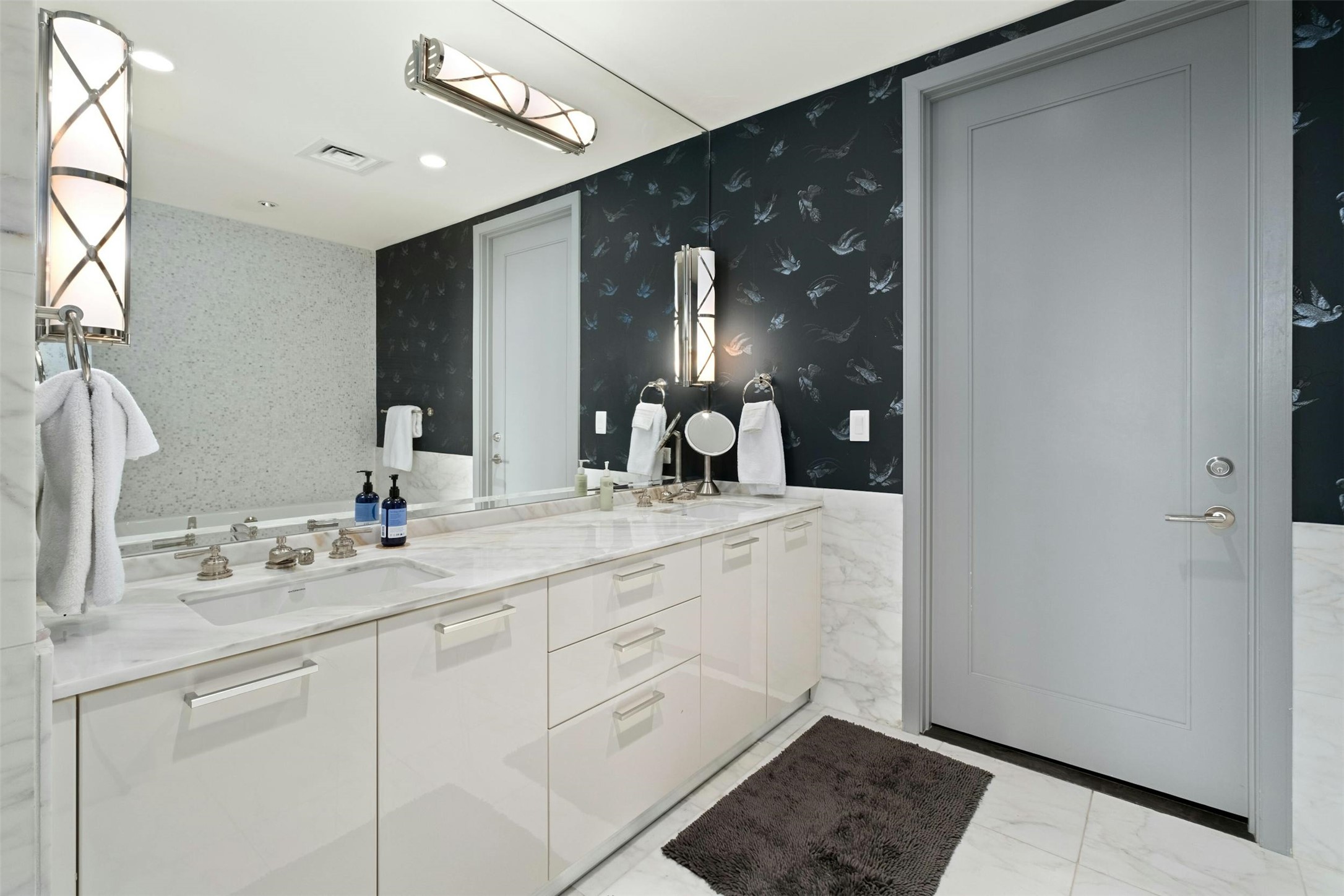 200 Congress Avenue, Unit 15D Austin, TX 78701 - Photo 14 of 23 a bathroom with a double vanity sink and a mirror