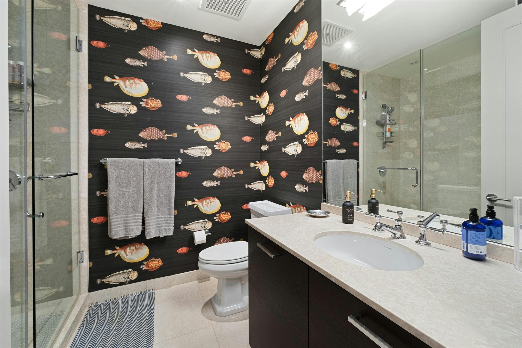 200 Congress Avenue, Unit 15D Austin, TX 78701 - Photo 17 of 23 a bathroom with a sink a toilet and shower