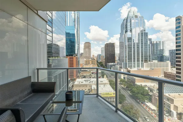 a view of a balcony with city view