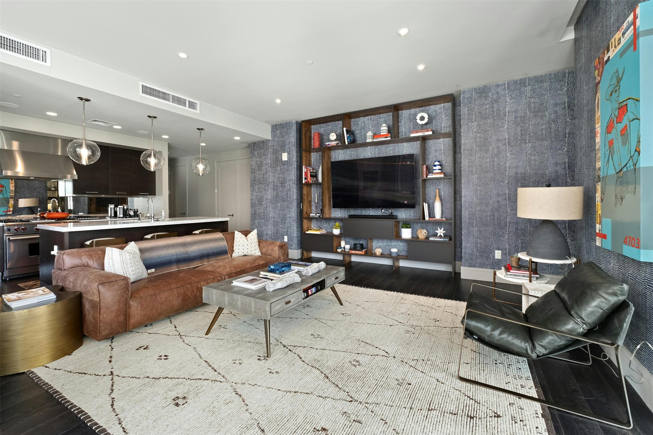 200 Congress Avenue, Unit 15D Austin, TX 78701 - Photo 2 of 23 a living room with furniture and a flat screen tv