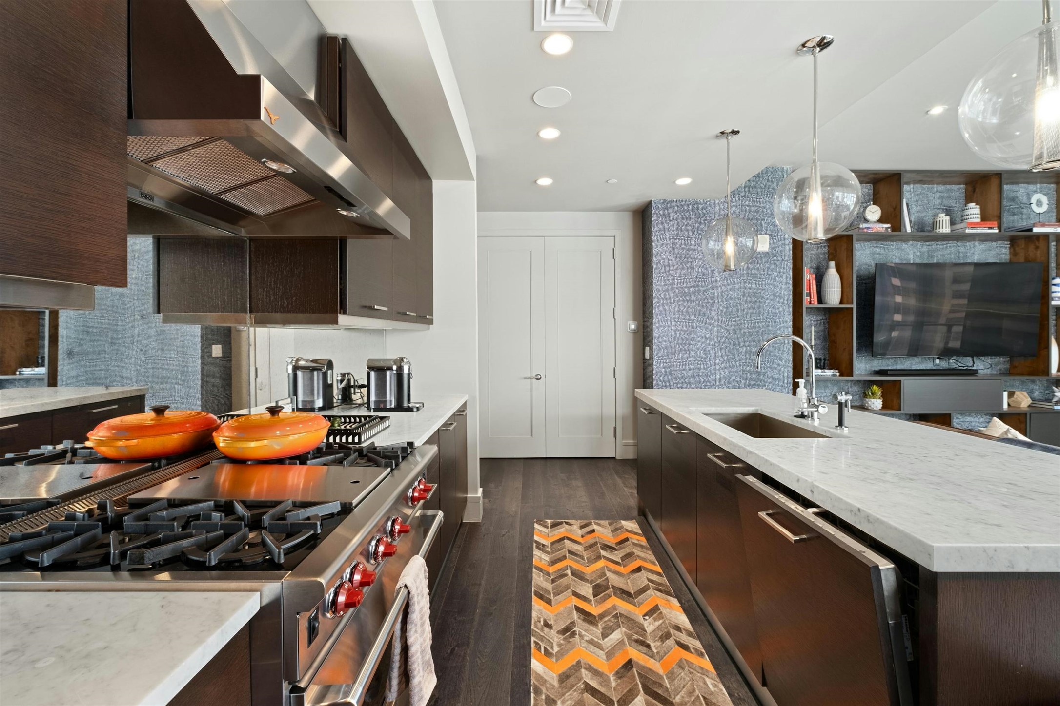 200 Congress Avenue, Unit 15D Austin, TX 78701 - Photo 6 of 23 a kitchen with stainless steel appliances granite countertop a stove and a sink