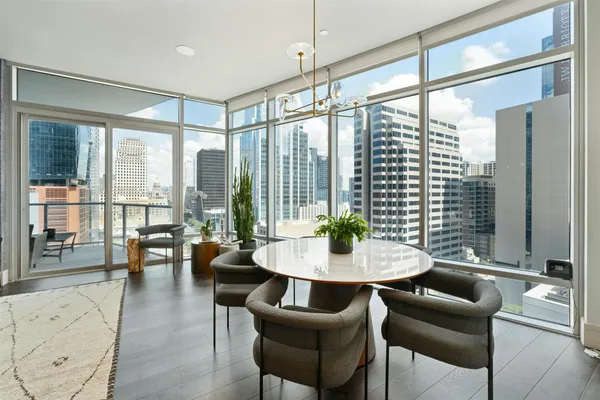 a view of a dining room with furniture window and outside view