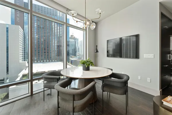 a view of a dining room with furniture window and outside view
