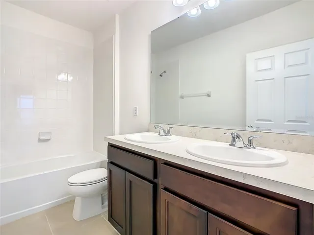a bathroom with a shower and cabinets