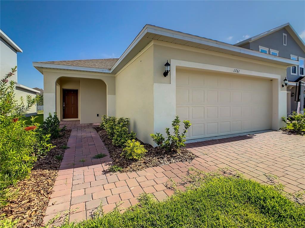 1761 Tree Shade Drive Davenport, FL 33837 - Photo 2 of 20 a front view of the house