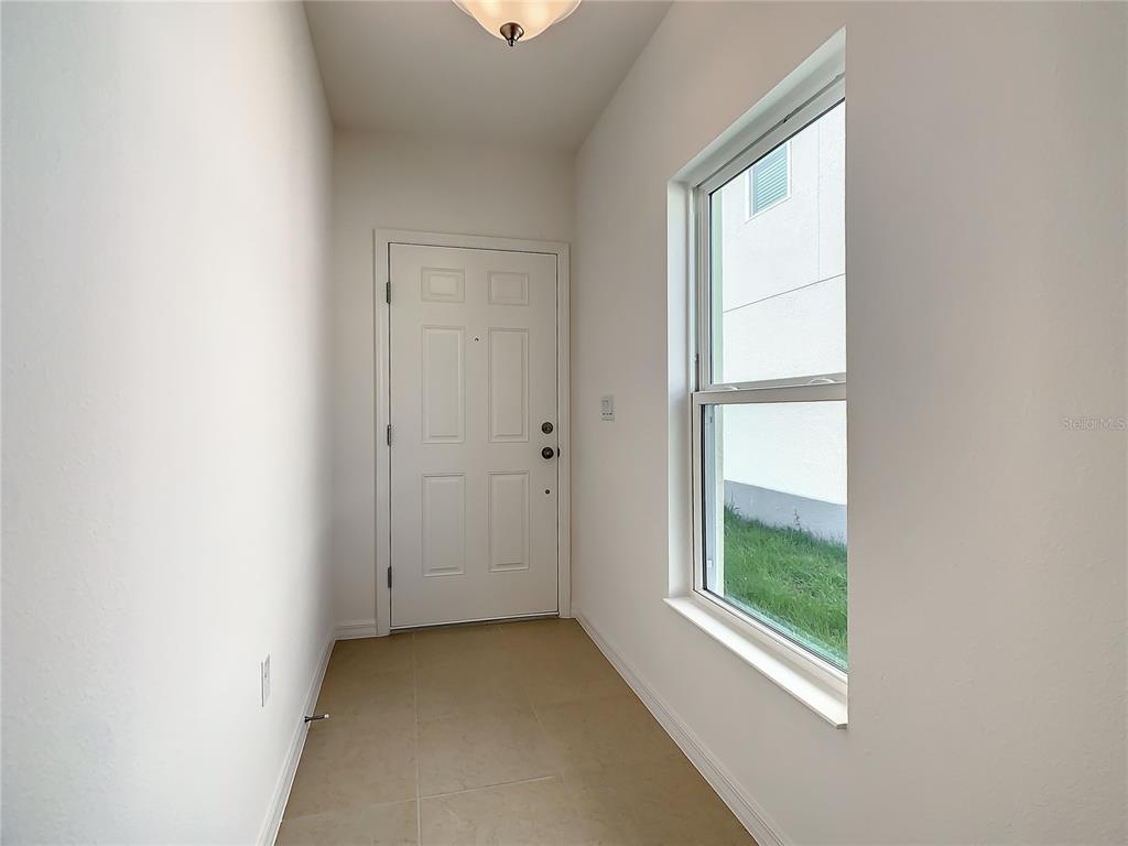 1761 Tree Shade Drive Davenport, FL 33837 - Photo 3 of 20 an empty room with windows