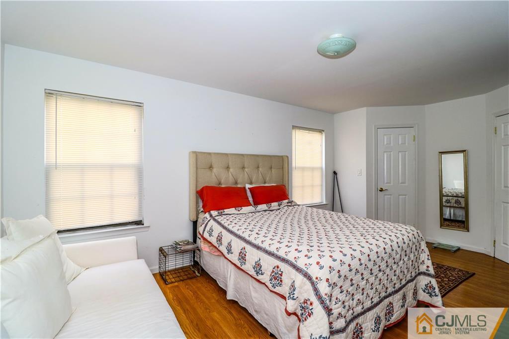 2901 Stonehedge Road, Unit 2901 Edison, NJ 08820 - Photo 14 of 25 a bedroom with a bed and window