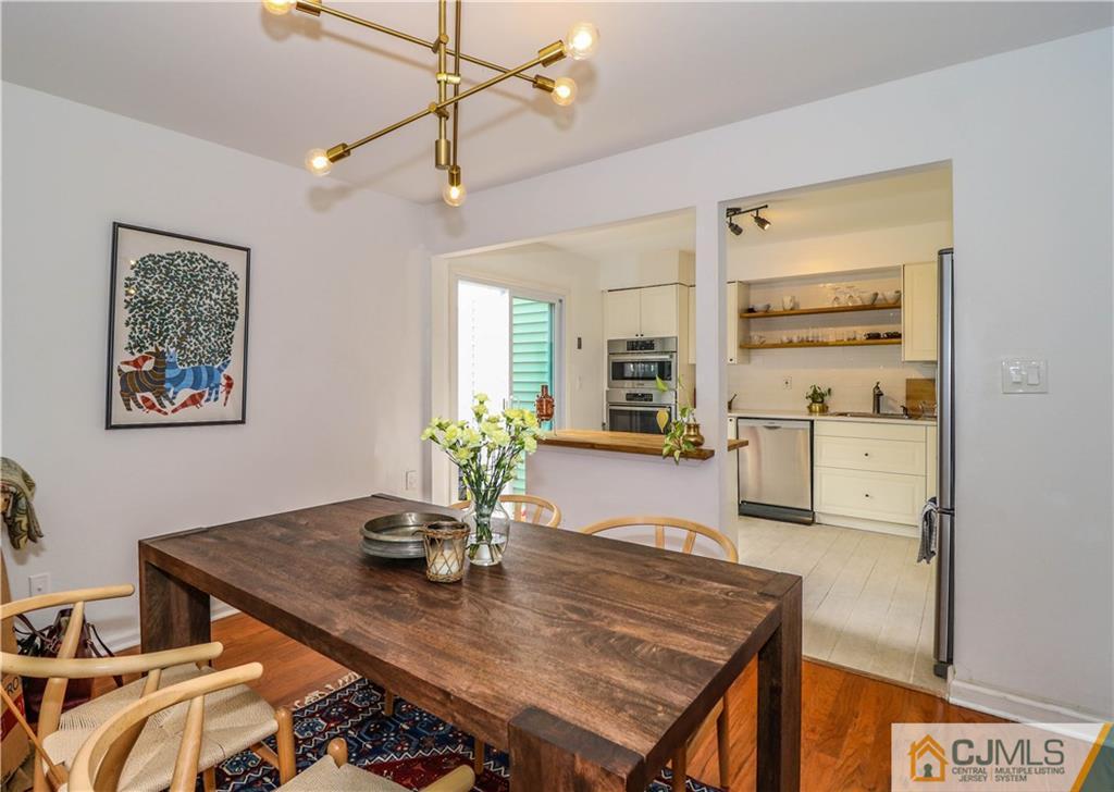 2901 Stonehedge Road, Unit 2901 Edison, NJ 08820 - Photo 4 of 25 a view of a dining room with furniture