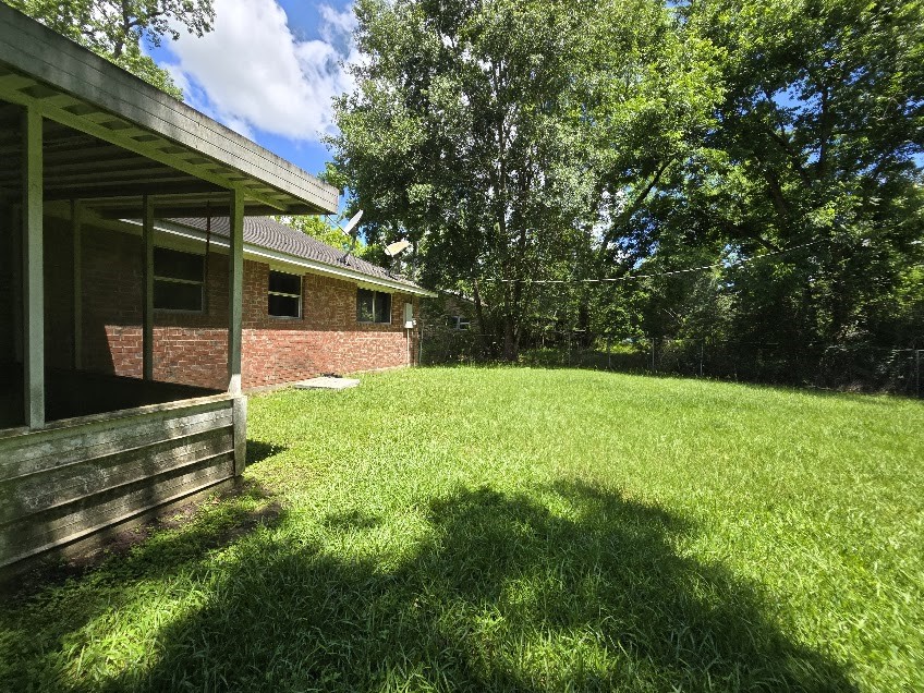 509 Bobcat Lane Daisetta, TX 77533 - Photo 26 of 26 a view of backyard with a garden and entertaining space