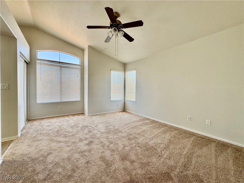 1828 Badger Canyon Avenue North Las Vegas, NV 89031 - Photo 11 of 14 Empty room featuring lofted ceiling, light colored