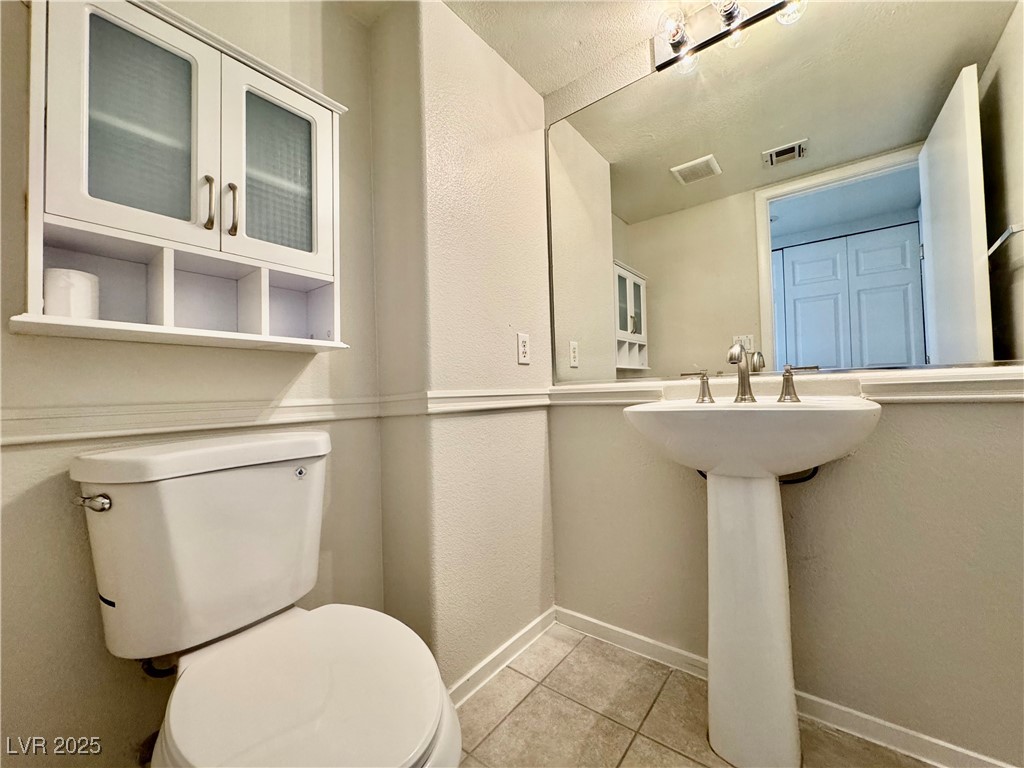 1828 Badger Canyon Avenue North Las Vegas, NV 89031 - Photo 6 of 14 Bathroom with toilet and tile patterned floors