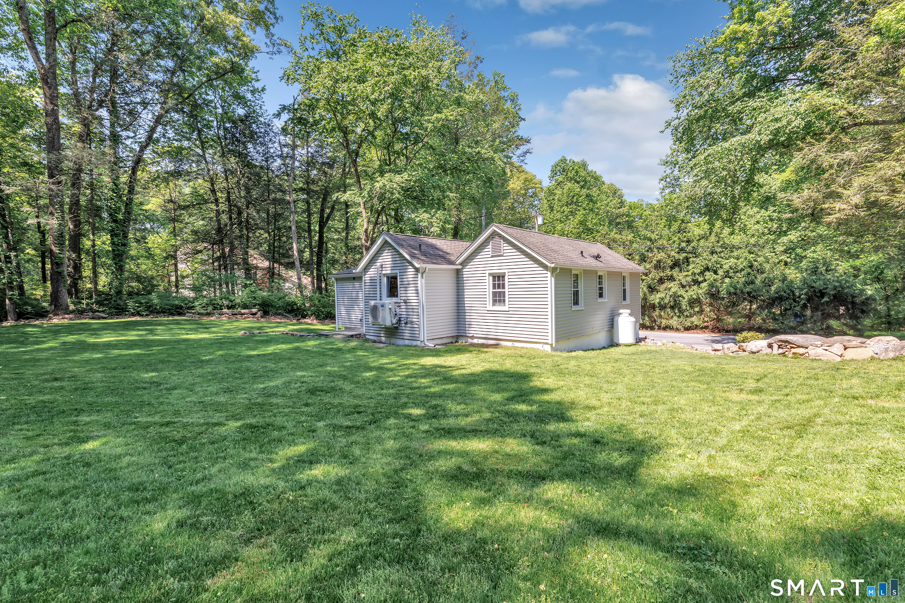 57 Olmstead Road Redding, CT 06896 - Photo 18 of 22 a view of a house with backyard and garden