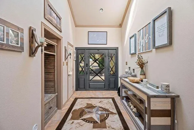 a bathroom with a granite countertop sink a mirror and a shower