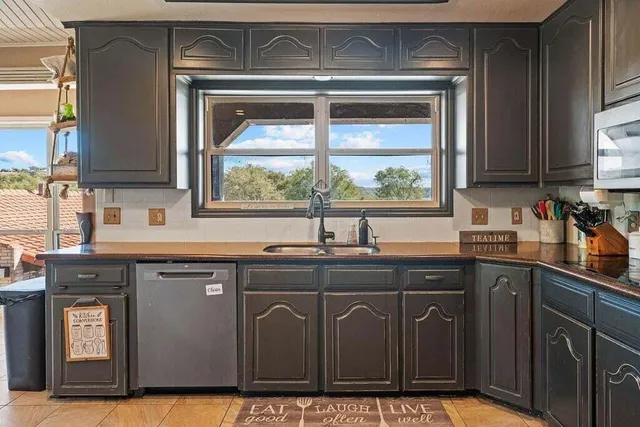 a living room with furniture and a book shelf