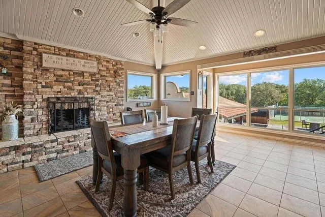 a view of a chairs and table in the patio with a yard