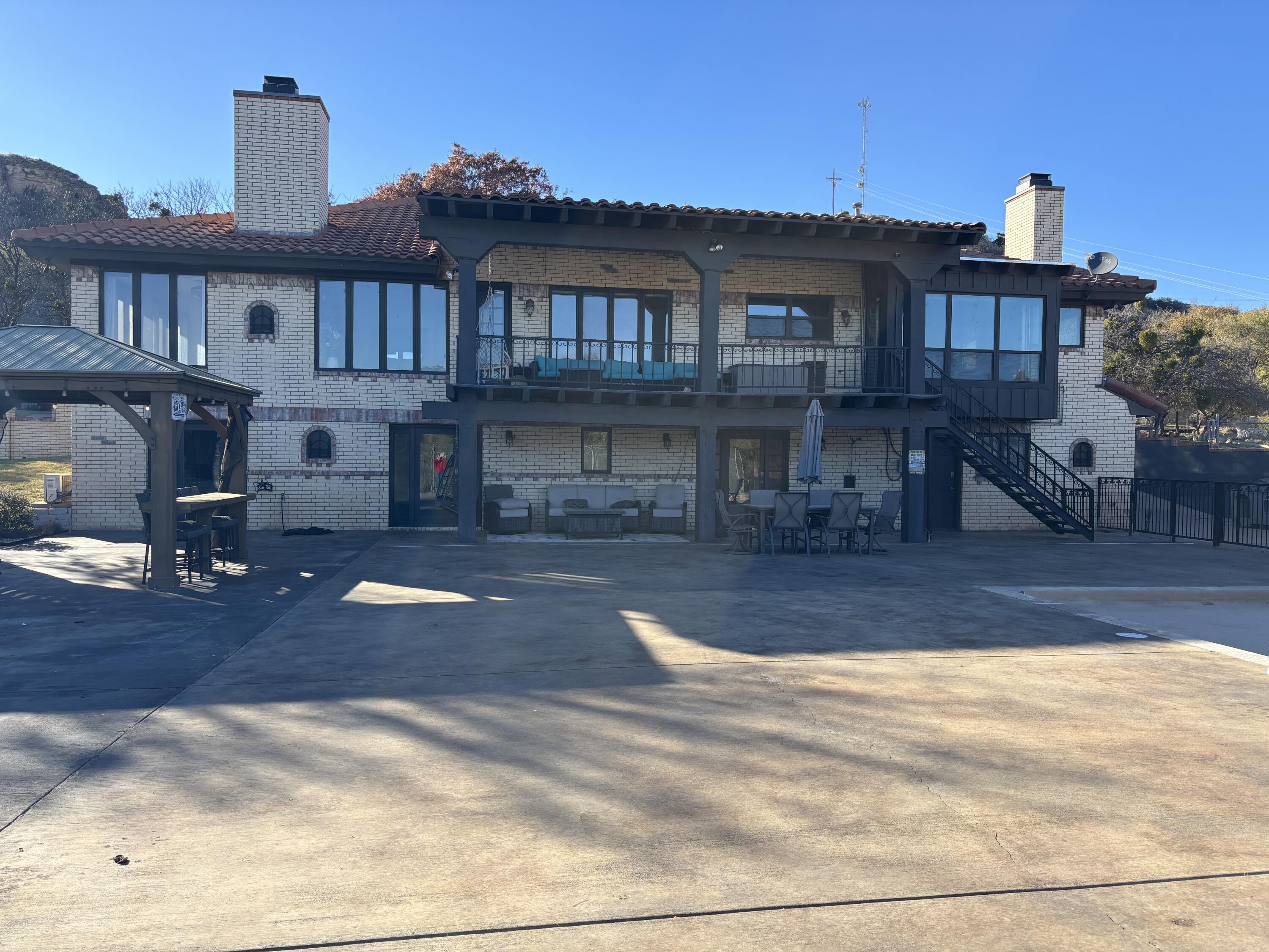 98 South Lakeshore Drive Ransom Canyon, TX 79366 - Photo 52 of 99 a view of a house with entertaining space