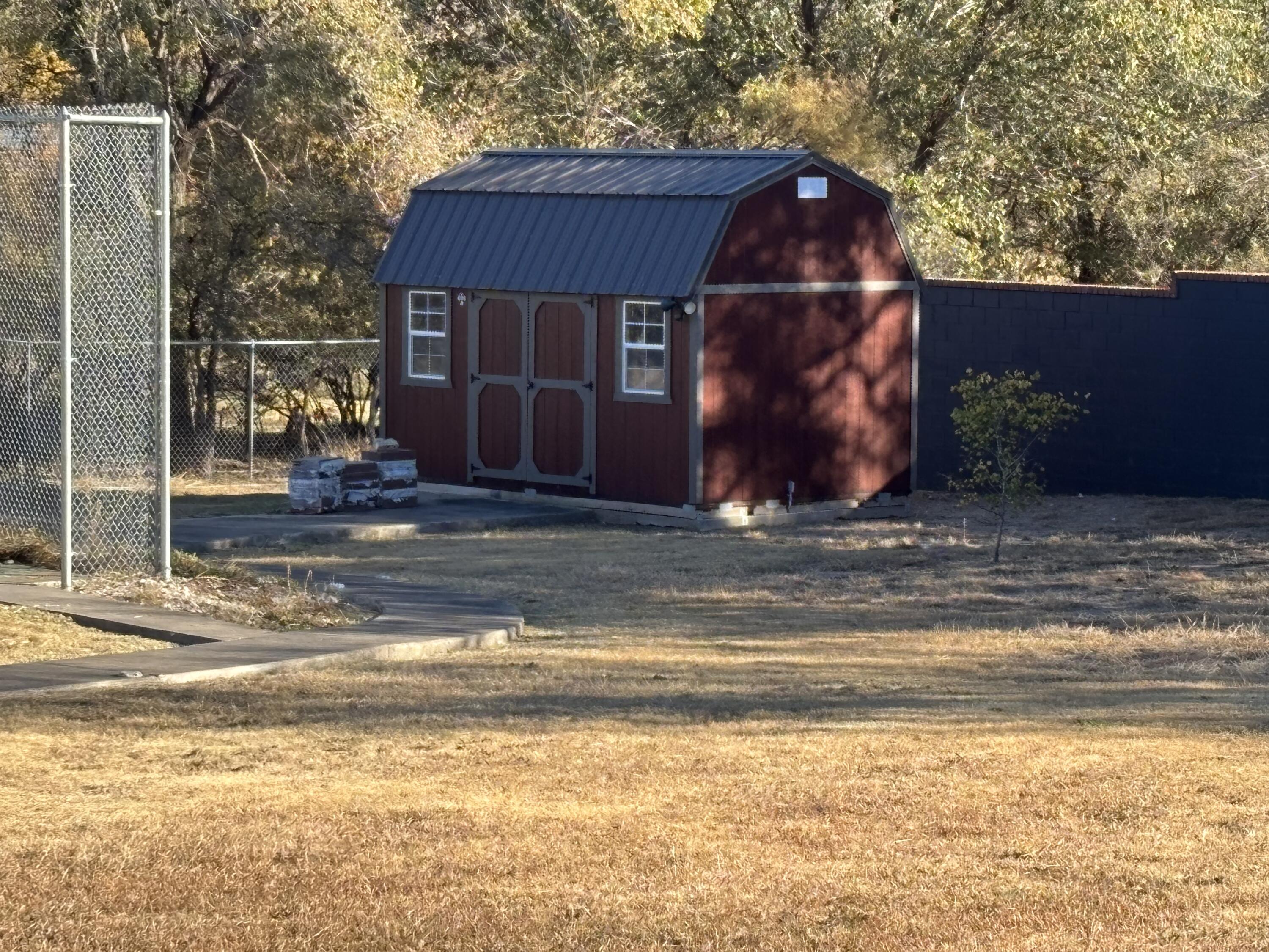 98 South Lakeshore Drive Ransom Canyon, TX 79366 - Photo 60 of 99 a front view of a house with a garden