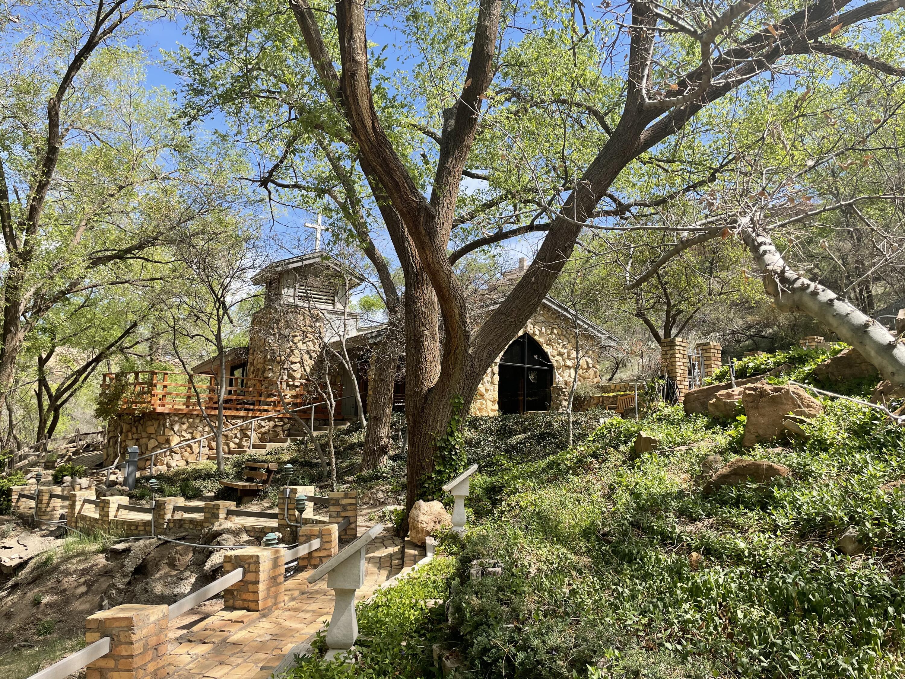 98 South Lakeshore Drive Ransom Canyon, TX 79366 - Photo 86 of 99 a yellow house with trees in front of it