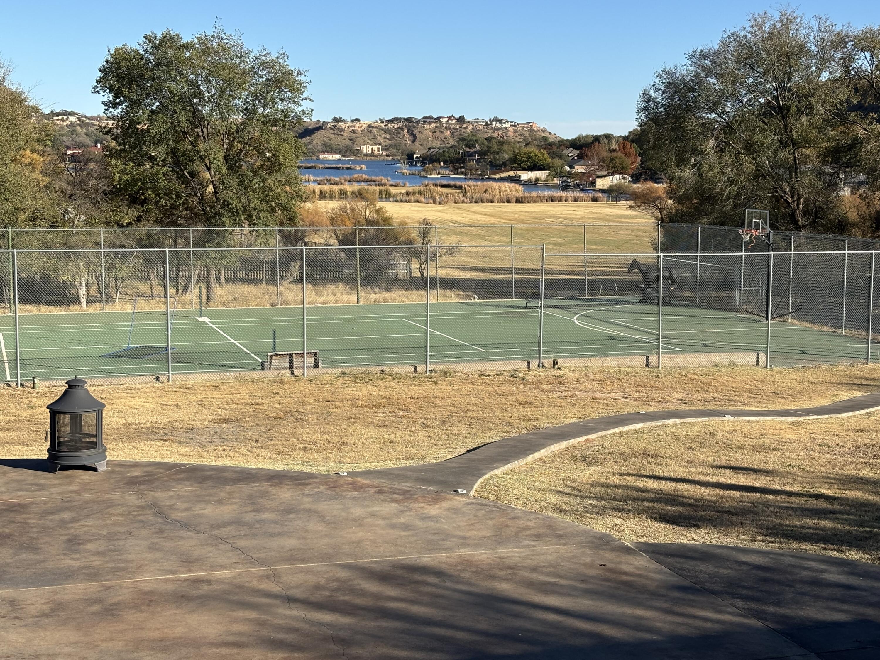98 South Lakeshore Drive Ransom Canyon, TX 79366 - Photo 10 of 99 a view of a houses with a lake