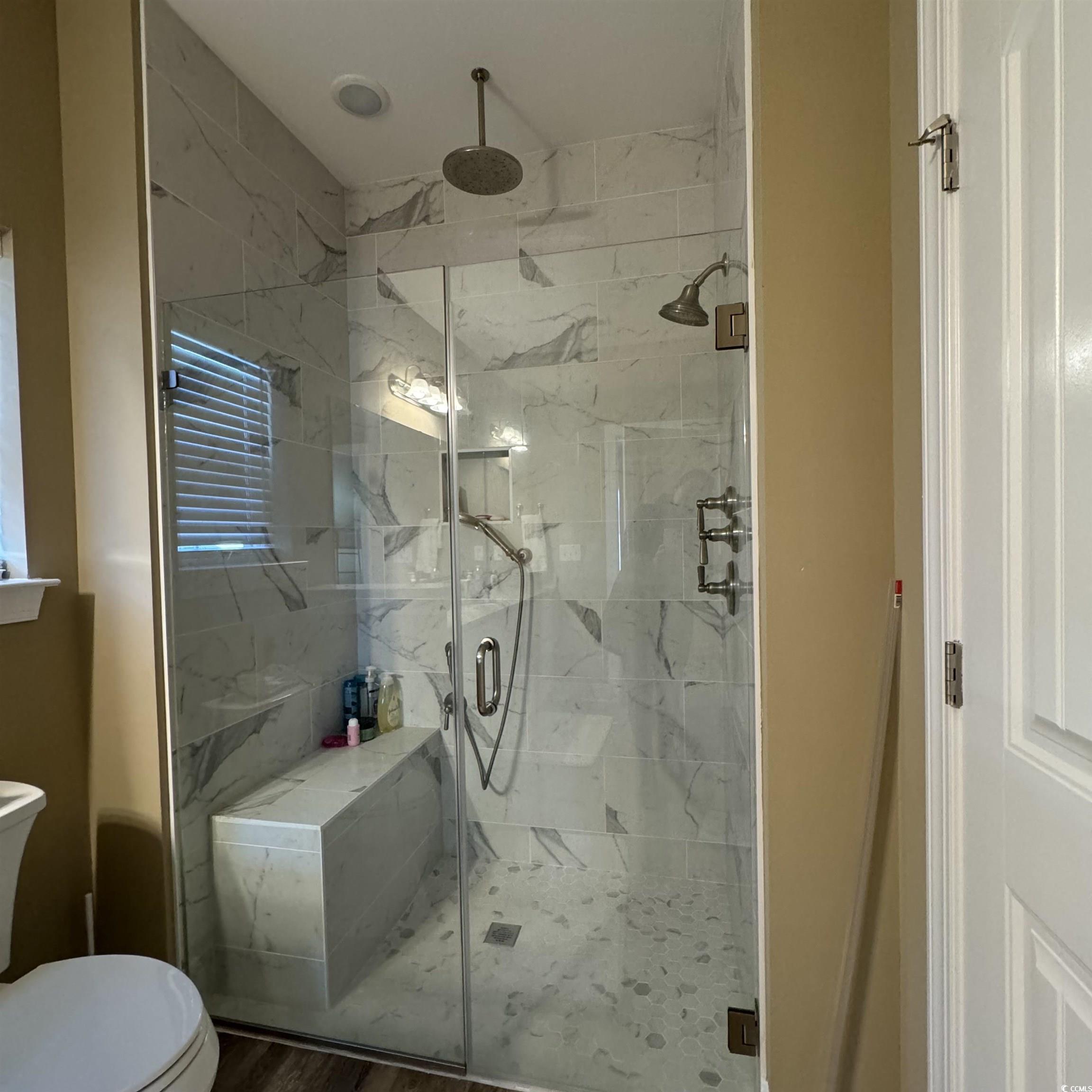 633 11th Avenue South Myrtle Beach, SC 29577 - Photo 19 of 25 Full bathroom featuring a marble finish shower