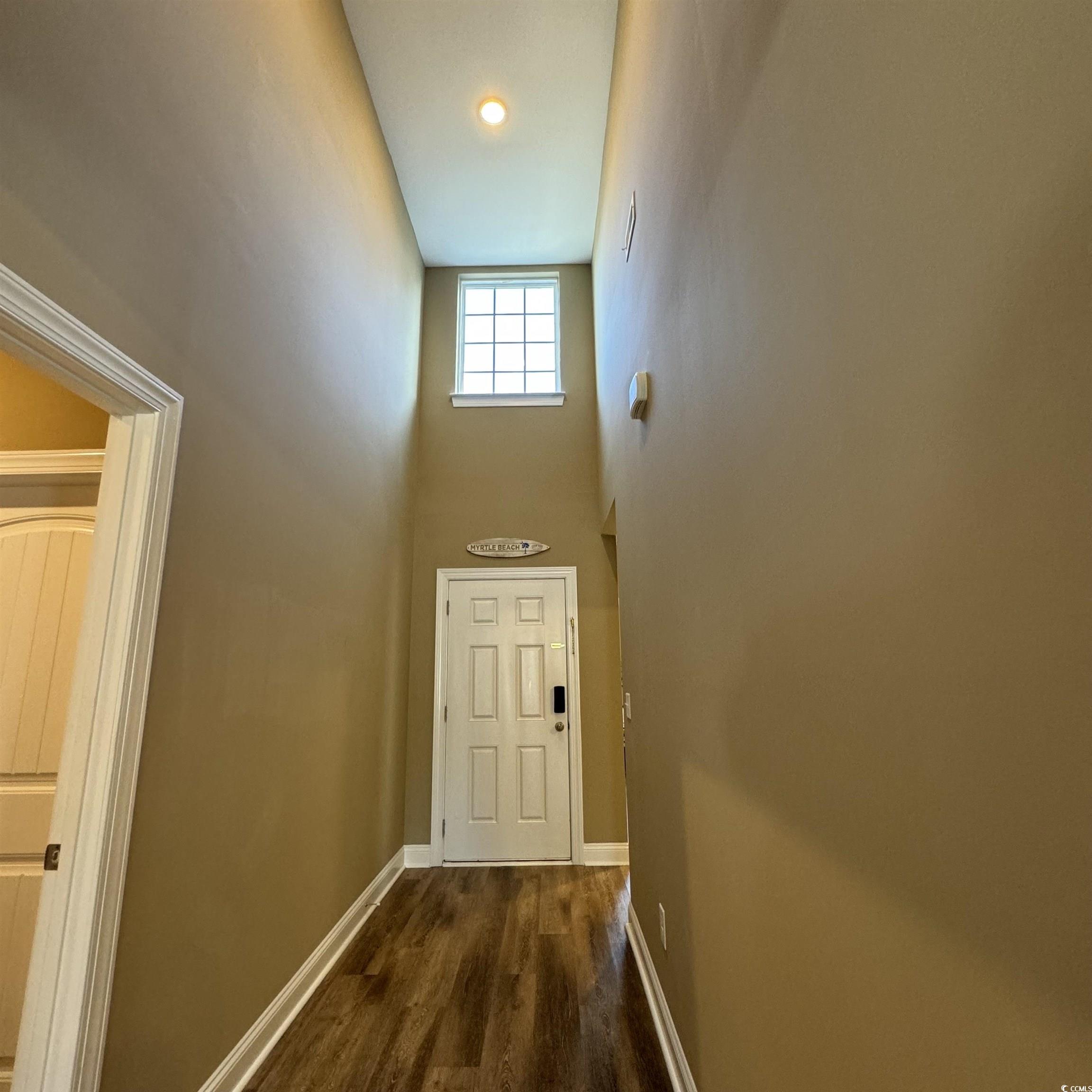 633 11th Avenue South Myrtle Beach, SC 29577 - Photo 5 of 25 Doorway with a high ceiling and wood finished floors
