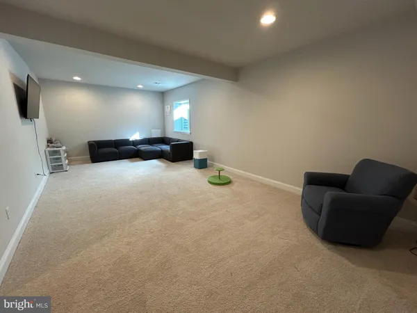 a view of livingroom with furniture and a flat screen tv