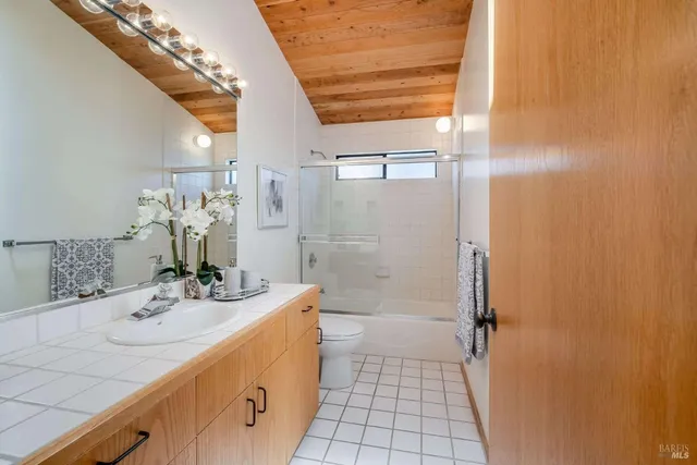 a room with furniture a window and wooden floor