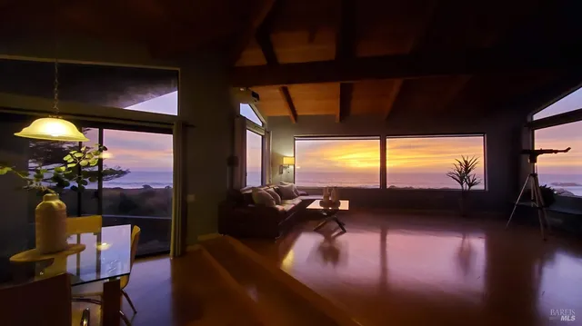 a view of a livingroom with furniture hardwood floor and a flat screen tv