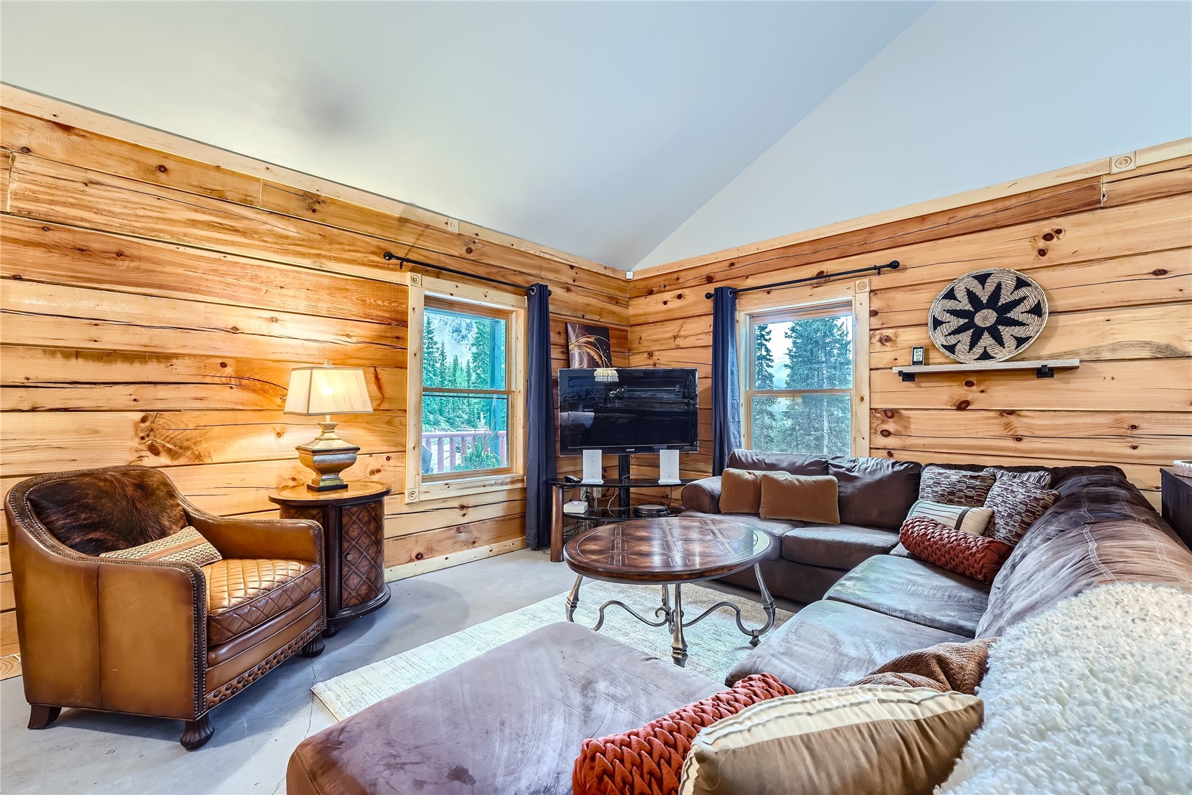 483 Bullion Mine Road Keystone, CO 80435 - Photo 4 of 28 The living space features abundant natural light, vaulted ceiling and plenty of space to relax.