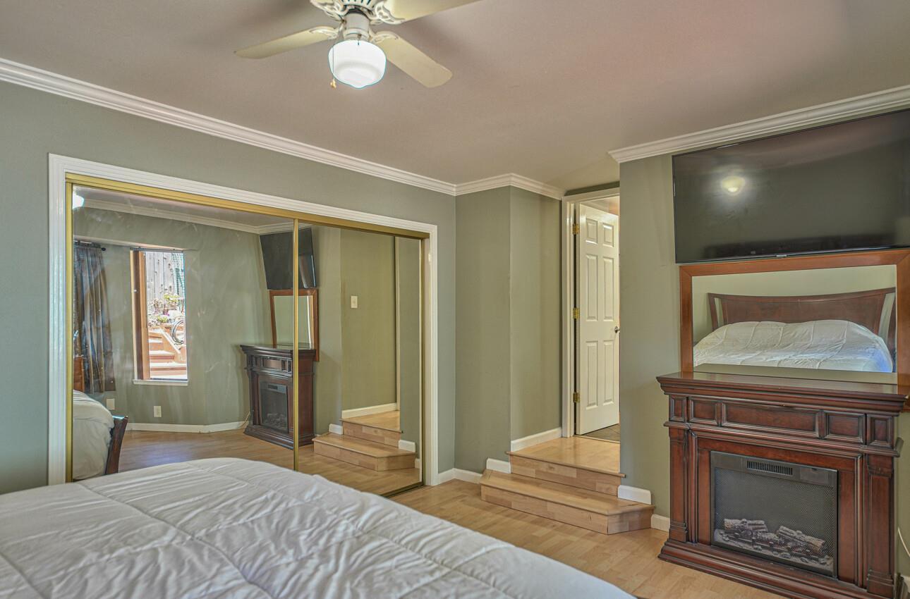 19205 Marjorie Road Salinas, CA 93907 - Photo 15 of 30 a bedroom with a bed and a fireplace