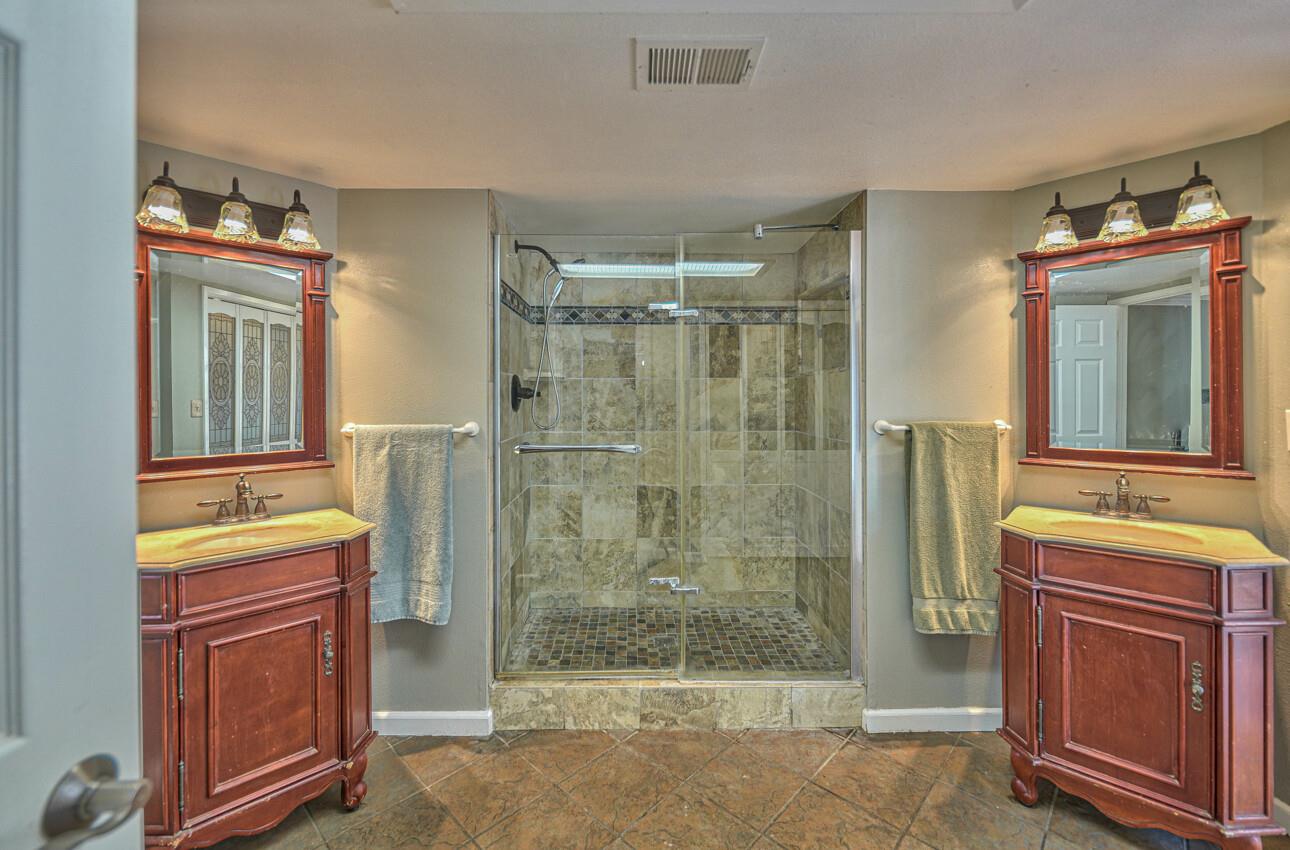 19205 Marjorie Road Salinas, CA 93907 - Photo 16 of 30 a bathroom with a shower a mirror and a sink