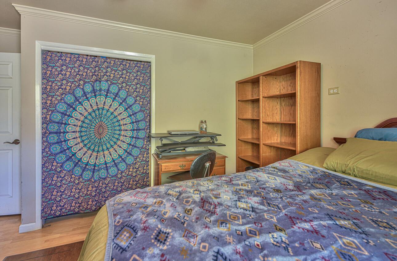 19205 Marjorie Road Salinas, CA 93907 - Photo 19 of 30 a bedroom with a bed and a flat tv screen on dresser