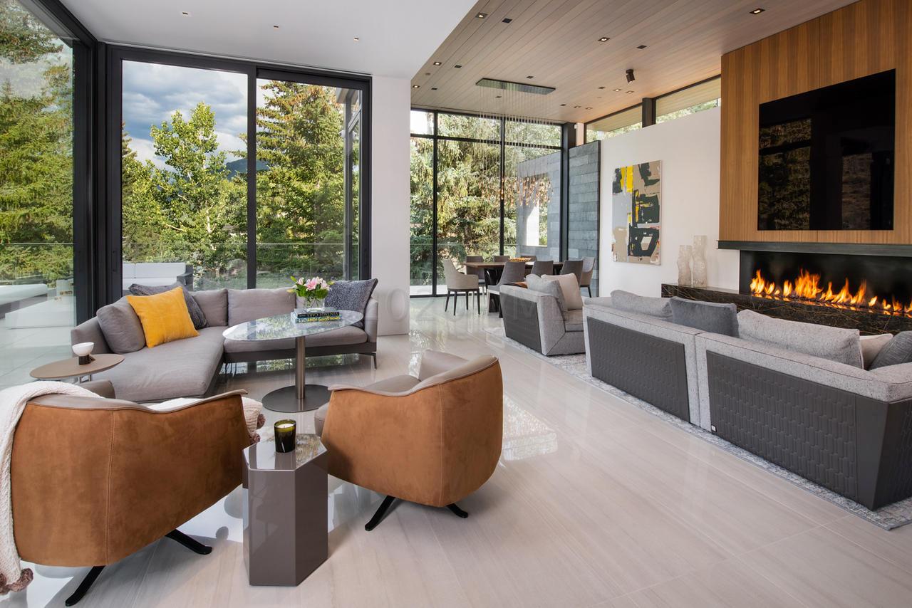 165 West Forest Road Vail, CO 81657 - Photo 4 of 56 Living area with sliding glass walls