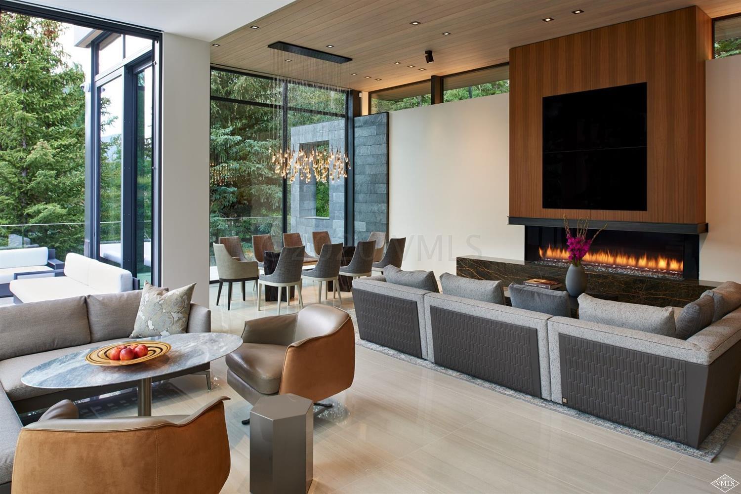 165 West Forest Road Vail, CO 81657 - Photo 44 of 56 Living room with marbel fireplace