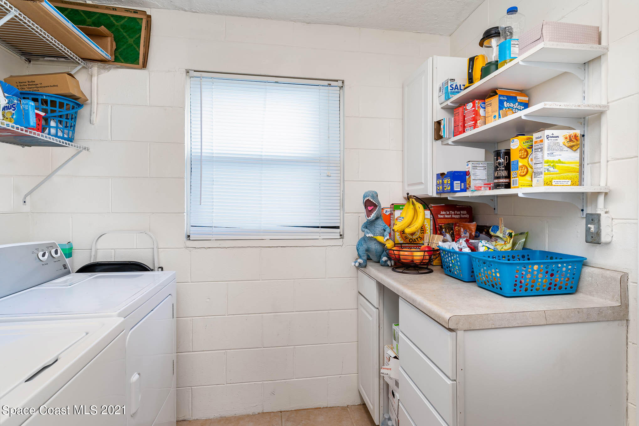 2285 Dolphin Road Titusville, FL 32780 - Photo 16 of 27 a utility room with dryer and washer