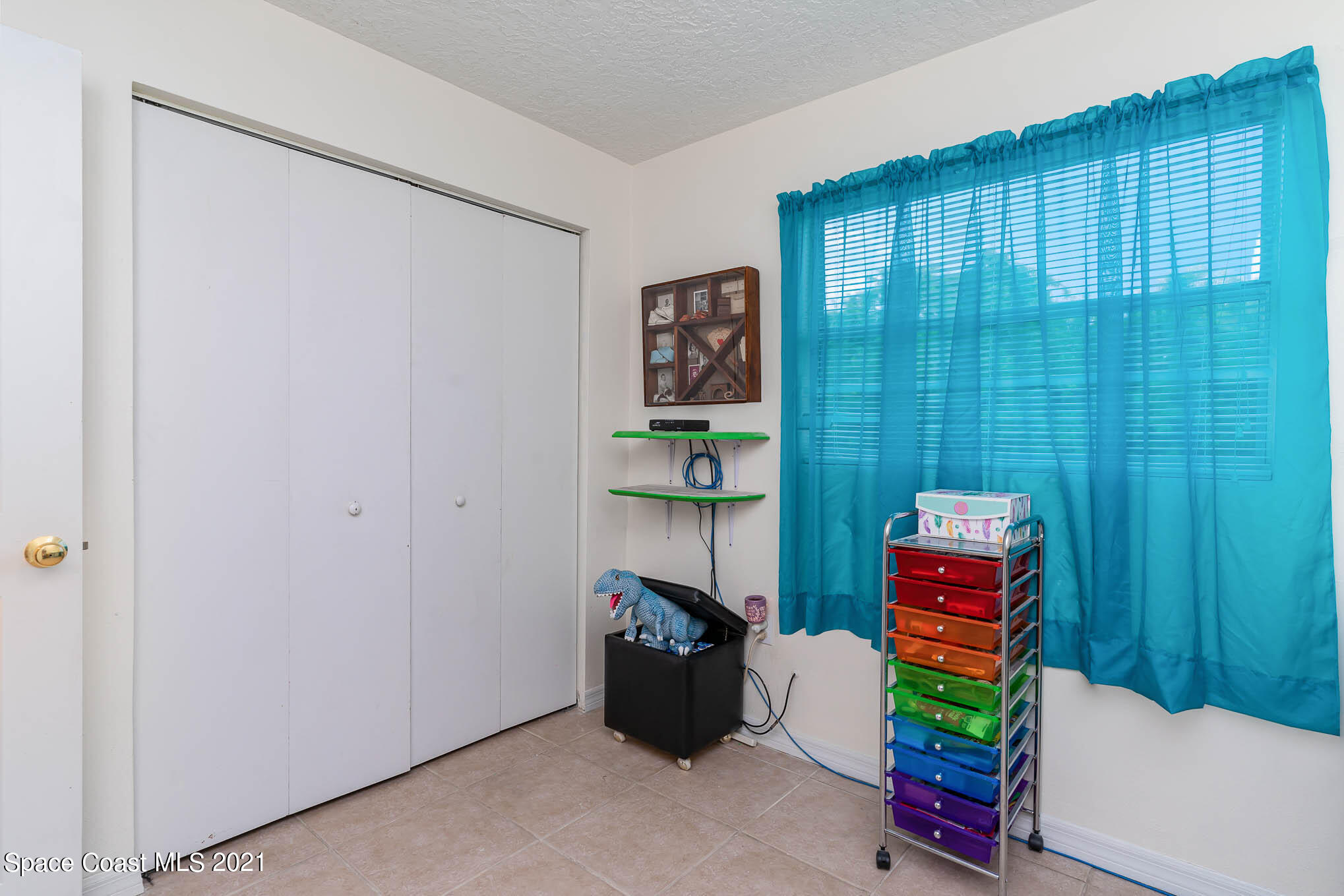 2285 Dolphin Road Titusville, FL 32780 - Photo 19 of 27 a room with furniture and a window